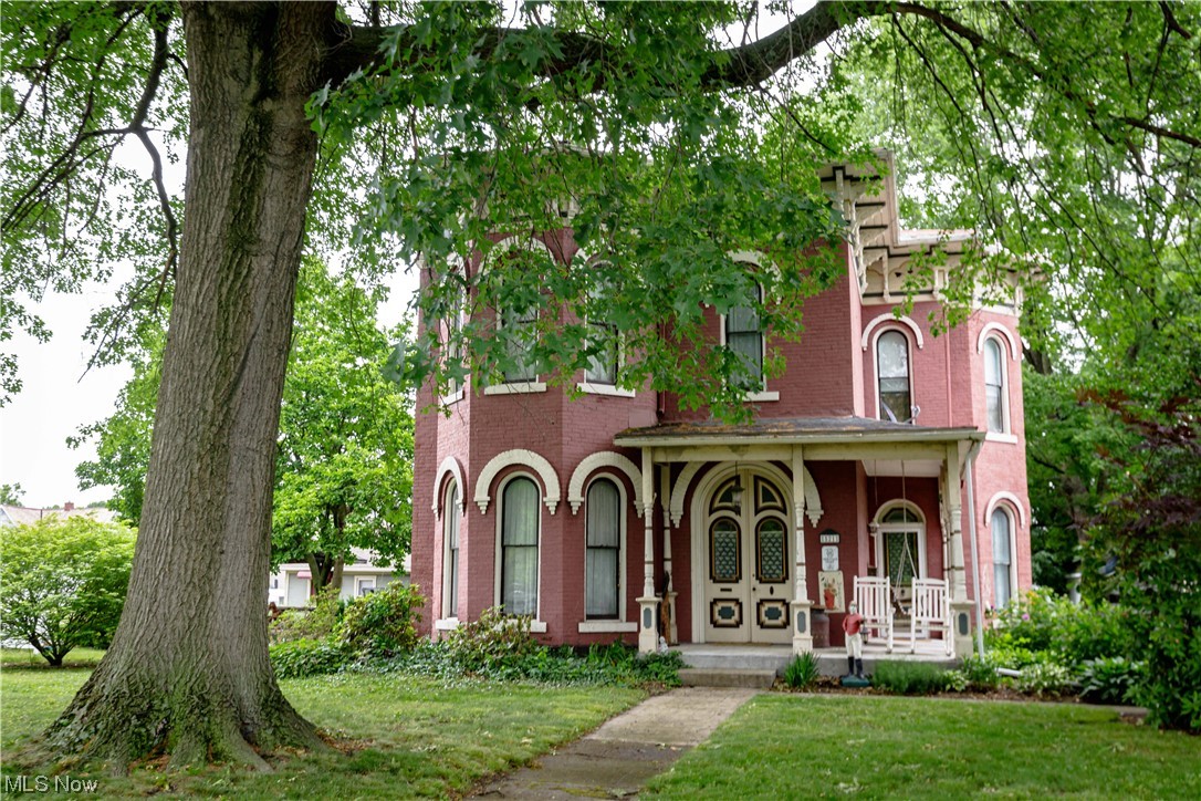 Enjoy all of the charm and character that this beautifully restored Victorian home has to offer while still having many of today's modern amenities. Built in 1881 and having over 3,300 sq. ft. this wonderful property was used as a Bed & Breakfast from 2011 - 2019. The main level features a custom library room with incredible woodwork and a fireplace, a large living room with refinished hardwood floors and fireplace that is open to the formal dining room, an updated kitchen with tile floor and appliances, an updated full bathroom and a 1st floor bedroom with another fireplace. Rounding out the first floor is a separate in-law suite with it's own bedroom, full bathroom and full kitchen/living room area. Up the spiral staircase you'll find 3 more ample sized bedrooms, another large sitting room with fireplace and an updated full bathroom with laundry area. Other features include newer central air, a cement patio area, a private flat back yard, a detached garage and more. This is a fantastic property located in the heart of Dover and it's close to Amish Country, wineries, shopping and restaurants.