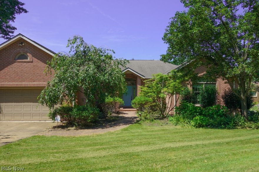 Wonderful all brick ranch in the Dells right in the heart of North Canton. Tucked away in a unique, private neighborhood on a picturesque lot. Attention to detail and quality were not missed here.  Solid doors, tray ceilings, crown molding, transom windows, built-ins… the list goes on and on. Very large open kitchen that will satisfy the person that loves to cook.  An all season sun room that leads to the oversized deck are great places to enjoy nature. To top things off the walk out lower level is beautifully finished. In the lower level there is another bedroom with a walk-in closet a full bath and a great recreation area with a fireplace and wall of built-ins.