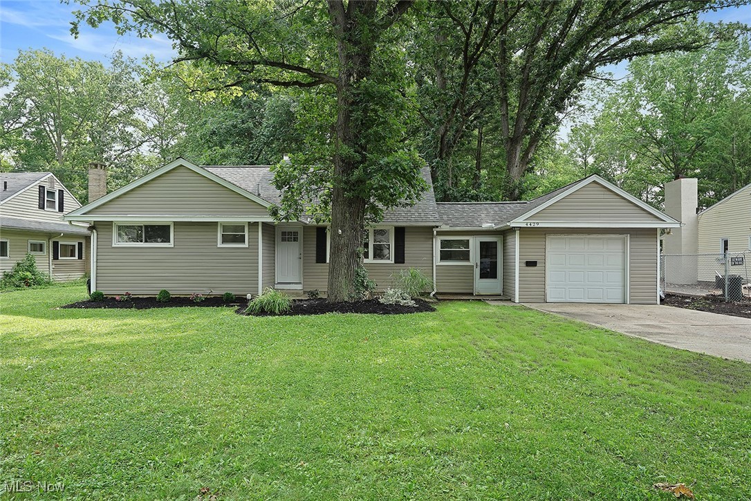 Tucked away on a quiet lot with many mature trees, this updated ranch offers a peaceful, wooded setting with the convenience of being just minutes from shopping, restaurants, and highway access. Step inside to an open-concept layout where the dining area flows seamlessly into the living room and a stylishly upgraded kitchen. The kitchen features two-tone shaker cabinets, granite countertops, a tile backsplash, and a pot filler above the stove, perfect for all home cooking.
Off the main living area, you'll find three well-sized bedrooms and a beautifully updated full bath. The living room looks out over a deep backyard filled with trees, creating a truly serene view. Just off the dining room, a laundry room with an attached half bath offers added functionality, along with access to the attached one-car garage.
A standout feature is the finished bonus space upstairs, complete with a loft area and a fourth bedroom, plus extra storage tucked behind the walls, ideal for guests, a playroom, or a private office.
Step outside to the sprawling back deck, offering plenty of space for relaxing, dining, and entertaining. Adjacent to the deck is a cozy outdoor hangout area with a propane fireplace, and further into the yard you'll find a wood-burning fire pit and children's play set for those perfect Ohio evenings.
With thoughtful upgrades throughout, modern style, and a truly unique lot, this home is a rare find in North Olmsted
