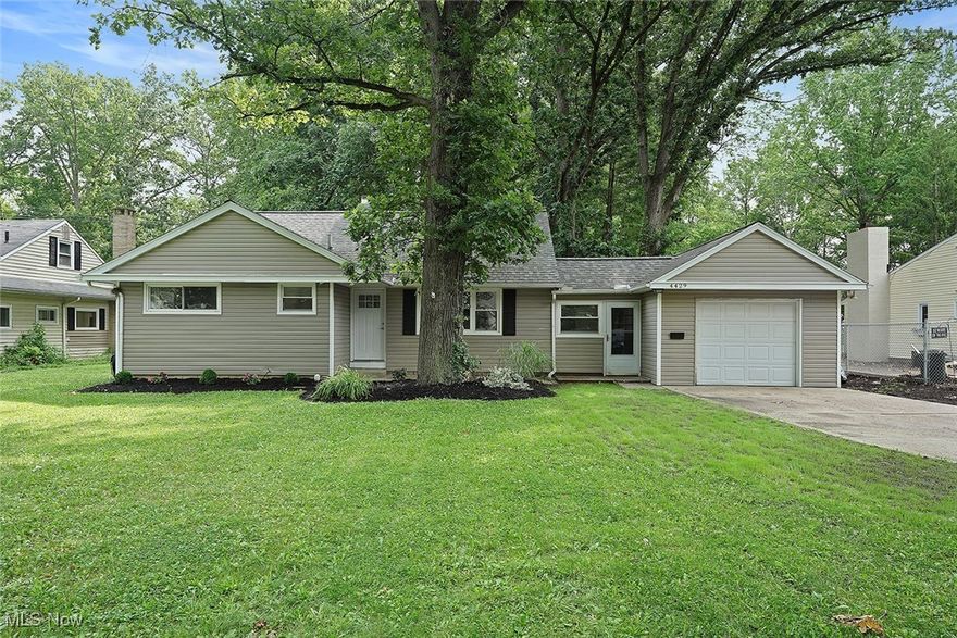 Tucked away on a quiet lot with many mature trees, this updated ranch offers a peaceful, wooded setting with the convenience of being just minutes from shopping, restaurants, and highway access. Step inside to an open-concept layout where the dining area flows seamlessly into the living room and a stylishly upgraded kitchen. The kitchen features two-tone shaker cabinets, granite countertops, a tile backsplash, and a pot filler above the stove, perfect for all home cooking.

Off the main living area, you'll find three well-sized bedrooms and a beautifully updated full bath. The living room looks out over a deep backyard filled with trees, creating a truly serene view. Just off the dining room, a laundry room with an attached half bath offers added functionality, along with access to the attached one-car garage.

A standout feature is the finished bonus space upstairs, complete with a loft area and a fourth bedroom, plus extra storage tucked behind the walls, ideal for guests, a playroom, or a private office.

Step outside to the sprawling back deck, offering plenty of space for relaxing, dining, and entertaining. Adjacent to the deck is a cozy outdoor hangout area with a propane fireplace, and further into the yard you'll find a wood-burning fire pit and children's play set for those perfect Ohio evenings.

With thoughtful upgrades throughout, modern style, and a truly unique lot, this home is a rare find in North Olmsted