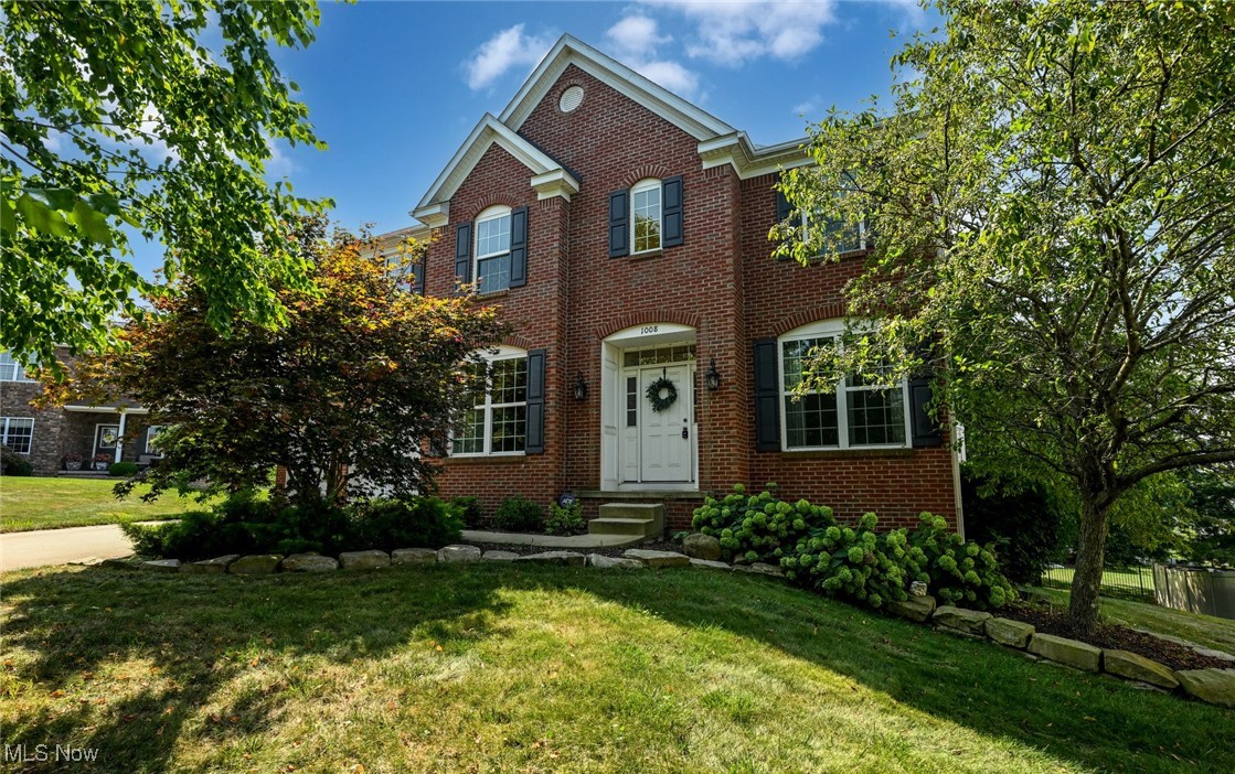 Discover a refined Colonial offering 5 BD, 4 BA, built in 2010 and sited on a quiet cul-de-sac in the Spring Hill neighborhood. Offering 4,172 square feet of beautifully designed living space, this home blends timeless elegance w/modern comfort. A classic brick and vinyl façade sets a welcoming tone, while a 2-story foyer flanked by formal living & dining rooms welcomes guests w/abundant natural light from a transom window. The open, flowing floor plan features hardwood floors and a seamless connection between formal and casual spaces. A spacious two-story Great room w/wall of windows & gas fireplace creates the perfect backdrop for gatherings. Well-appointed, the kitchen features SS appliances, a breakfast bar, granite countertops, chic glass tile backsplash, a pantry, and a breakfast area with sliding doors leading to a composite deck. Also on the main level: a versatile bedroom or private den, a convenient full bath, and a laundry room equipped with a sink hookup. The upper-level features 4 generous bedrooms, anchored by a luxurious owner's suite. The suite opens through elegant French doors into a spa-inspired bath with a corner soaking tub, oversized walk-in shower, dual vanity, new flooring and a spacious walk-in closet. Three additional BDs and a full hall BA complete the upper level. A fully finished, walk-out LL includes an expansive recreation room with a distinctive tile/stone focal wall, a newer full bath, an exercise or multi-purpose room, and ample storage. Recent upgrades include: freshly painted throughout, motorized window treatments, a composite deck, and professionally landscaped grounds featuring birches, maples, and pines, creating a beautiful, private outdoor oasis. In the highly rated Green Local School District and just minutes from schools, parks, shopping, dining, golf, and I-77, 1008 Dalby Circle is more than a home; it’s a harmonious blend of architectural elegance, luxurious living, and thoughtful functionality. Schedule a showing today!