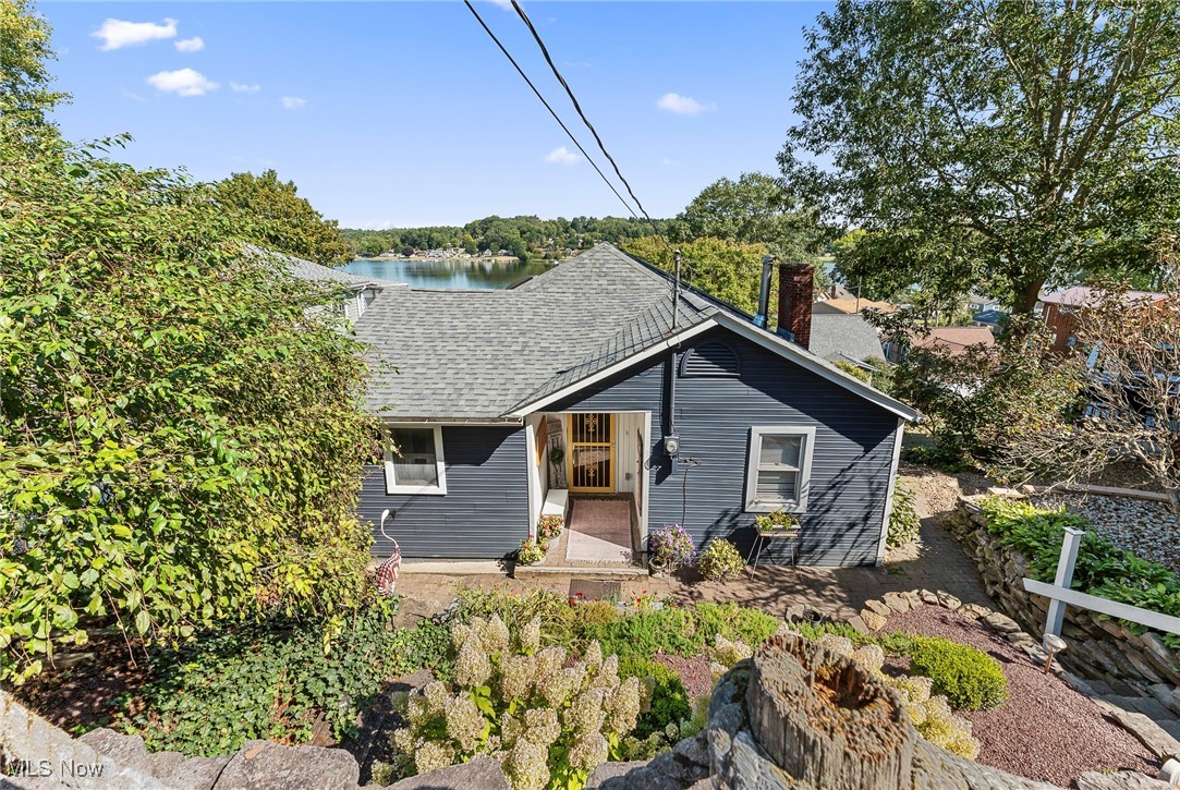 Welcome Home to Lakeside Living! This charming family-style home combines comfort, space, and breathtaking views of the lake. Step inside to find sun-filled living areas with an open flow, a modern kitchen perfect for gatherings, and cozy 3 bedrooms, 2 full bathrooms. Large windows frame serene water views, bringing a sense of peace and natural beauty into your everyday life. Outside, the backyard offers room for play and entertaining, all with the sparkling lake as your backdrop. Whether you’re enjoying morning coffee on the patio, watching the sunset over the water, or hosting summer barbecues, this home makes every moment unforgettable. Brand new furnace & AC - installed July 2025 - this home has an electric heat pump with a propane back up! New roof installed in 2021! Don't miss out on this one, call for your private showing before this one is SOLD!