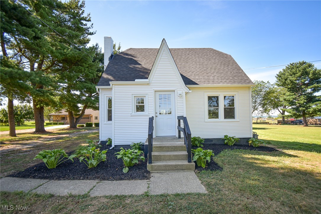 This beautifully renovated Cape Cod offers the perfect blend of charm and functionality, featuring four bedrooms, two full bathrooms, and a detached two-car garage, all situated on nearly half an acre. Lovely landscaping welcomes you to the front entry, where a foyer with a coat closet sets the tone for the thoughtfully designed interior. Step into the bright, open-concept living area where the living room and kitchen offer an airy, spacious feel. The kitchen is a showstopper, featuring a vaulted ceiling, quartz countertops, brand-new stainless steel appliances, an island with a breakfast bar, and ample cabinet and counter space. Easily access the backyard and garage through the rear door off the kitchen. Part of a brand-new 2025 addition that also includes the custom kitchen, the main floor boasts a private primary bedroom with a vaulted ceiling and direct access to the new stunning full bath, complete with a walk-in shower. A second bedroom rounds out the first floor. Upstairs, you’ll find two nicely sized bedrooms and a second updated full bath. The clean basement offers tons of storage space or is ready for your finishing touches - whether you envision a home gym, rec room, or additional living space. The backyard offers plenty of room to play, relax, or entertain and includes a few charming fruit trees. Additional major updates include a new roof, gutters, all new windows, a sump pump, A/C, and updated plumbing and electrical in 2025. With its upgrades, open layout, and serene outdoor space, this move-in-ready home is a must-see!