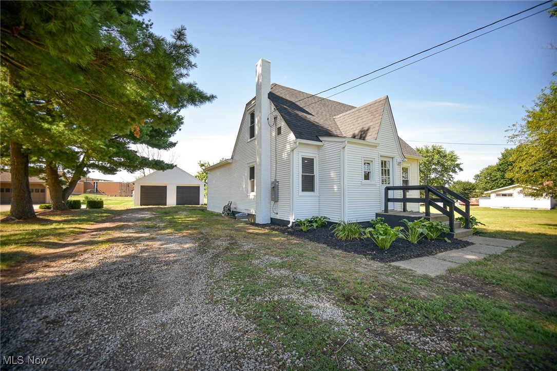 This beautifully renovated Cape Cod offers the perfect blend of charm and functionality, featuring four bedrooms, two full bathrooms, and a detached two-car garage, all situated on a full acre. Lovely landscaping welcomes you to the front entry, where a foyer with a coat closet sets the tone for the thoughtfully designed interior. Step into the bright, open-concept living area where the living room and kitchen offer an airy, spacious feel. The kitchen is a showstopper, featuring a vaulted ceiling, quartz countertops, brand-new stainless steel appliances, an island with a breakfast bar, and ample cabinet and counter space. Easily access the backyard and garage through the rear door off the kitchen. Part of a brand-new 2025 addition that also includes the custom kitchen, the main floor boasts a private primary bedroom with a vaulted ceiling and direct access to the new stunning full bath, complete with a walk-in shower. A second bedroom rounds out the first floor. Upstairs, you’ll find two nicely sized bedrooms and a second updated full bath. The clean basement offers tons of storage space or is ready for your finishing touches - whether you envision a home gym, rec room, or additional living space. The backyard offers plenty of room to play, relax, or entertain and includes a few charming fruit trees. Additional major updates include a new roof, gutters, all new windows, a sump pump, A/C, and updated plumbing and electrical in 2025. With its upgrades, open layout, and serene outdoor space, this move-in-ready home is a must-see!
