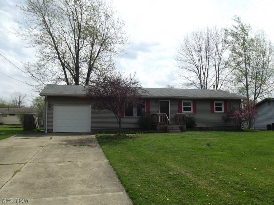 A great place to call home! New Kraftmaid hickory kitchen w/center island. New wood Pergo flooring throughout the home in 2013. Built-in cabinets in living room. Breathtaking ne bathroom w/double sinks, ceramic tub surround & ceramic floor in 2013. Finished basement w/rec room and half bath. Fenced yard. Furnace new in 2009, 100 AMP breaker box in 1998. Cement patio & deck off kitchen.  This home is a real pleasure to show! New roof June, 2014.