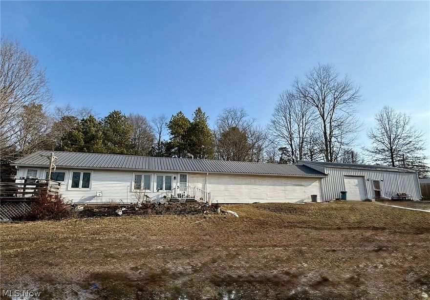 This unique home on a lovely 1.43 acre lot with a country feel is located just a few minutes from Marietta and convenient to Belpre and Parkersburg but in the desirable Warren School District.  The large living room with a wall of closets has plenty of space for relaxing with family and friends.  The cozy kitchen and dinette area offer multiple opportunities.  The spacious master bedroom also features lots of closet space.  Down the hall are two additional rooms that can be used as bedroom or den/office and bedroom.  There is an attached 1 car garage and an additional large workshop that can be used for a multitude of hobbies or business opportunities.  The large lot has lots of room for outdoor activities, entertaining or just relaxing,  This home is located adjacent to a 3 bedroom family home creating a unique opportunity for relatives to live nearby but with their own space.  The possibilities are endless.  Look at both and imagine what could be!