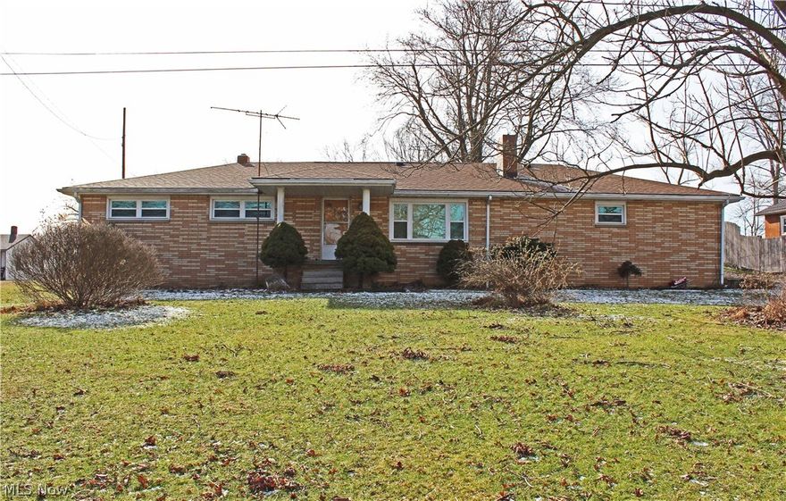 This wonderful brick ranch situated on a level .91 acre lot won't last long!  3 BRs, 1 1/2 BAs, huge eat-in kitchen, freshly painted throughout, brand new living room carpet, roof only 4 yrs. old, updated vinyl replacement windows, hardwood floors in bedrooms, remodeled bath and more!  Full basement with rec room and office, oversized 2 car attached garage and a home warranty make this a home run!