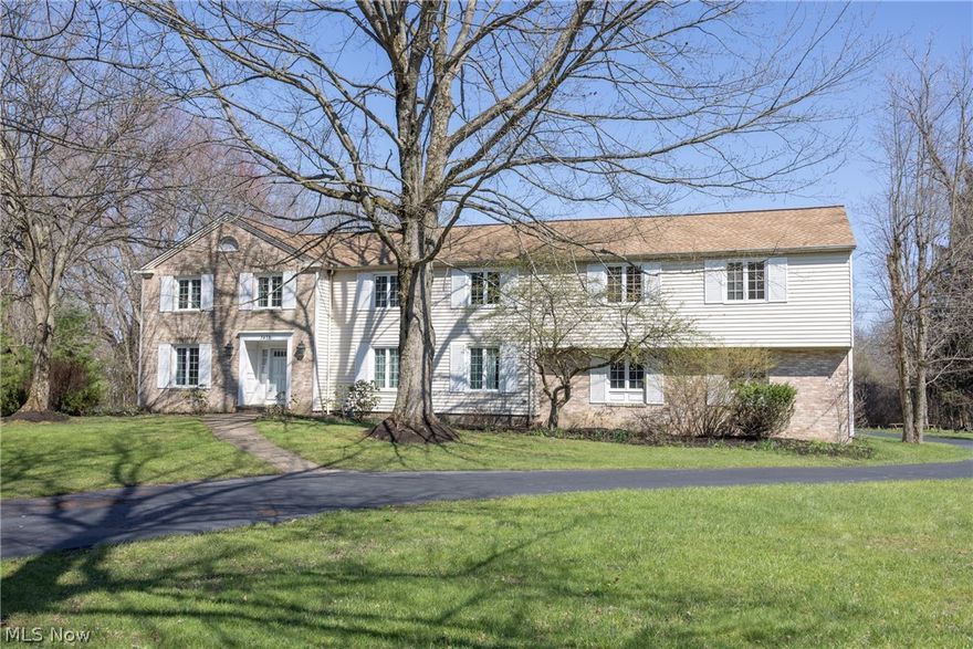 Rarely do you find this much scale paired with such a premier Pepper Pike address.Set on a quiet street in Rolling Hills, this 4,600+ square-foot residence offers an unbeatable location near Lander Circle,parks,shopping,restaurants,library,and Orange City Schools.The interior is defined a seamless,carpet-free layout featuring hardwood or tile flooring throughout. The heart of the home is a massive chef’s kitchen designed for serious entertaining. It features sleek quartz countertops, a monumental "aircraft carrier" island,and a high-capacity appliance suite including two refrigerators, two sinks, two cooktops (gas and induction), a double oven, and a dedicated water faucet. This space flows effortlessly into a sun-drenched family room with soaring cathedral ceilings, a private bar, and abundant natural light. For more formal gatherings, the traditional living and dining rooms provide elegant options for hosting. The second level is thoughtfully designed with six spacious bedrooms and three full and two half baths. The primary suite serves as a private retreat, complete with a dedicated dressing room and closet space, while a bonus den offers the perfect footprint for a quiet home office or a dedicated kids' hangout.Even more living space awaits in the finished basement, ideal for a home gym or media center. Beyond the interior, the home sits on an expansive, open, and flat lot with a vast backyard perfect for outdoor play.Peace of mind comes standard with an impressive list of recent mechanical and structural updates,including a new roof in 2021,majority of windows replaced in 2022,and three new AC units and two furnaces installed in 2023.Recent appliance upgrades include the cooktops, a 2025 washer, and a 2025 double oven. With three HVAC zones for customized comfort and the convenience of public water and sewer, this Rolling Hills gem is a rare find.To ensure a worry-free transition,a one-year home warranty is included for the new owners.