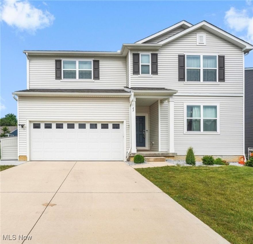 Experience refined living in this stunning, 2023-built residence in the highly sought-after Tallmadge Reserve. Offering 4 bedrooms, a private office, and 3.5 baths across 3,328 sqft plus 900 sqft of impeccably finished lower level space, this home blends modern elegance with thoughtful design. Step through the front door and be greeted by 9-foot ceilings and expansive sightlines that create a sense of openness and grandeur. Luxury vinyl plank flooring spans the main living areas, leading you into the designer kitchen, appointed with quartz countertops, a sprawling island, and premium cabinetry—perfect for both intimate dinners and lavish entertaining. Upstairs, the primary suite is a serene retreat featuring a spa-inspired ensuite with double quartz vanities, an oversized walk-in shower, and a spacious dressing closet. The second-floor laundry offers the ultimate in convenience. The finished lower level is an entertainer’s dream with a full bath and flexible living space—ideal for a home theater, fitness studio, or guest quarters. Outside, a multi-level deck and patio create the perfect backdrop for al fresco dining and sunset gatherings. Set within a vibrant, modern community and just minutes from local amenities, this home offers a rare opportunity to enjoy luxury new construction without the wait. This is more than a home—it’s a statement of style and sophistication.