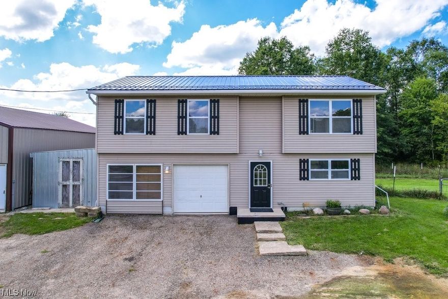 Welcome home to 341 State Route 225 in Atwater! This well-maintained 3 Bed/2 Bath home is located on 10 spacious acres that are absolutely perfect for a hobby farm. The 2nd level features neutral paint & ceramic tile, an open & bright living room, a large eat-in kitchen w/appliances that stay, a newer sliding glass door (2021) leading to the 2-level deck overlooking the wooded lot. 3 bedrooms are located on the 2nd level w/a full bath accessed from both the hall & the Master. Head down to the lower level where you will find an additional living area that could be used as a 4th bedroom or a rec room, a 2nd full bath & utility room. Newer metal roof (2023) & a water softener (2021). The 10-acre property was previously used as an organic farm raising chickens/pigs/turkeys & features a 30x40 metal pole building w/12 ft walls & partial slab, pond w/aerator, metal 11x18 meat processing room that can be converted back to a garage or storage, a dog door off the 2 car garage with fenced area, electrical outlets installed outside on property, septic with a newer lift pump (2018) & 200 amp service. The pole barn has the following equipment which could be purchased separately by the buyer - 4 wheeler, small tractor, air compressor, welding machine, a whole house generator, sauna, commercial refrigerator, poultry crates, industrial racks, & chick feeders. Located just minutes from shopping in nearby Alliance & University of Mount Union. Make an appointment to come see this home today!