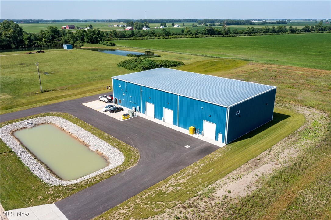 This exceptional, newly built commercial property at 19 Fort Monroe Parkway in Monroeville offers approximately 11,250 square feet of versatile space, ideally suited for office or light industrial applications. Fully equipped with all essential utilities including electric, gas, water, and sewer, the building boasts a comprehensive climate control system featuring a dual mini-split system and radiant heat that extends to dedicated parking areas, complemented by forced-air central air in the office areas. The interior includes an ADA-compliant reception area, two bathrooms, adaptable spaces perfect for offices or small conference rooms, and a convenient kitchenette, all designed for Energy Star efficiency. Robust construction is evident with a durable metal standing seam roof featuring a 30ft eve on the low side and a 31'6" back, alongside three 14-foot high overhead doors with openers for efficient loading and access, and robust 3-phase electric service to support diverse operational needs. The shop floor further includes two additional bathrooms and a mechanical room. This building is suited for installation of a 10 ton overhead crane. Zoned for Commercial, Industrial, and Agricultural use, this property offers significant development potential with a lot split, encompassing approximately 3 acres with the existing building. An additional 5 vacant acres for future expansion or multi-tenant opportunities can be discussed. With its robust infrastructure and flexible zoning, this property is ideal for a wide range of businesses, including light industrial and manufacturing, warehousing and distribution centers, contractor and automotive service companies, as well as agricultural-related businesses seeking versatile space with strong utility support and expansion potential.