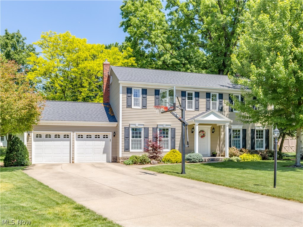This immaculate Colonial is situated on a quiet cul de sac in the highly sought after Hills and Dales subdivision in the Copley/Fairlawn school district. Current homeowners since 1992 have lovingly maintained and carefully updated it by always adding extra features to improve it's appearance and value. Crisp clean exterior plus a lush green lawn and landscaping with a large flat backyard and brick paver patio with a view that makes you feel like you are at the park! Foyer entry, extra spacious formal living room, formal dining room, eat in kitchen overlooks the family room with wood burning fireplace. Gorgeous hardwood floors throughout. 5 bedrooms allows plenty of space for family, visitors or office! Squeaky clean basement with plenty of room to finish. New roof,windows, siding and 6" gutters all within the past 10 years. Ideal location, lovely setting, superb condition. Must see!