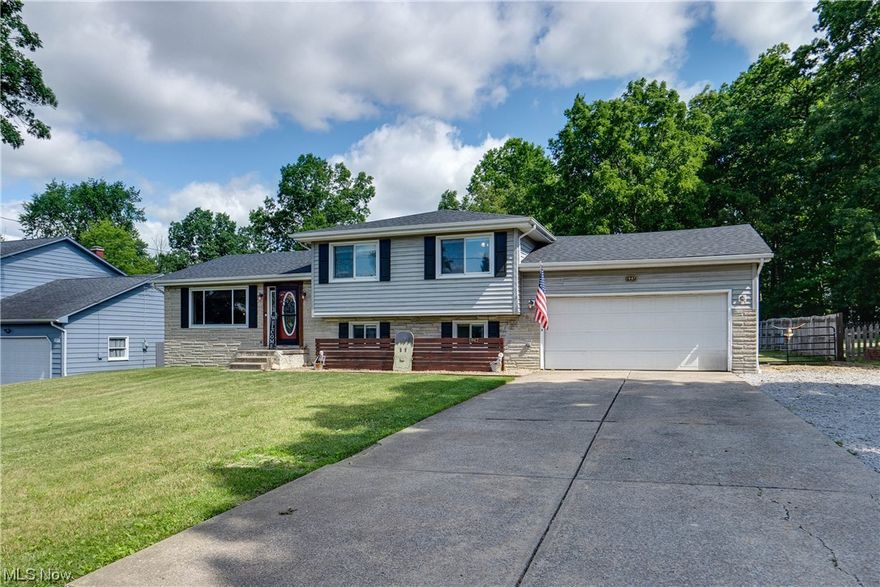 This adorable 4-level split home in Mineral Ridge is a must-see! With its charming exterior and well-maintained interior, it offers a comfortable and inviting living space. Inside, you'll find three spacious bedrooms with the option for a fourth bedroom, providing flexible living arrangements. The home also boasts two full bathrooms, ensuring convenience. One of the highlights of this property is the oversized two-car garage, which offers ample storage space and room for multiple vehicles. Additionally, the fully fenced backyard provides private outdoor area for relaxation and entertainment. Numerous updates have been made to this home, enhancing its value and appeal. These updates include a new furnace in 2018, an updated AC system in 2019, a new hot water tank in 2020, and a new roof and deck in 2019. Don't miss out on the opportunity to make this lovely home your own. Call today to schedule a showing and see all that this property has to offer.