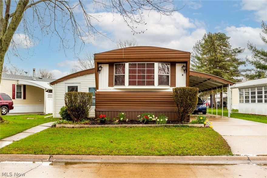 This 840 sq ft. 2 bedroom/2 bath mobile home is priced just right.  This home boast a beautiful enclosed 22 x 10 porch for additional space.  There is a covered car port, a good sized storage shed, poured concrete steps, seasonal flowers out front.  Mfg by Schult in 1979.  The living/dining and kitchen floor has been updated along with the fridge and range.  Built in dining room cabinet allows for additional storage.  Previous owner put in electrical upgrade and new skirting in 2017.  Large walk in storage closet.  55+ Gated Community in Olmsted Falls featuring on-site shopping center, management and social hall, walking paths, shuffle boards, bocce ball, crafts, classes, and library. Selling as-is.