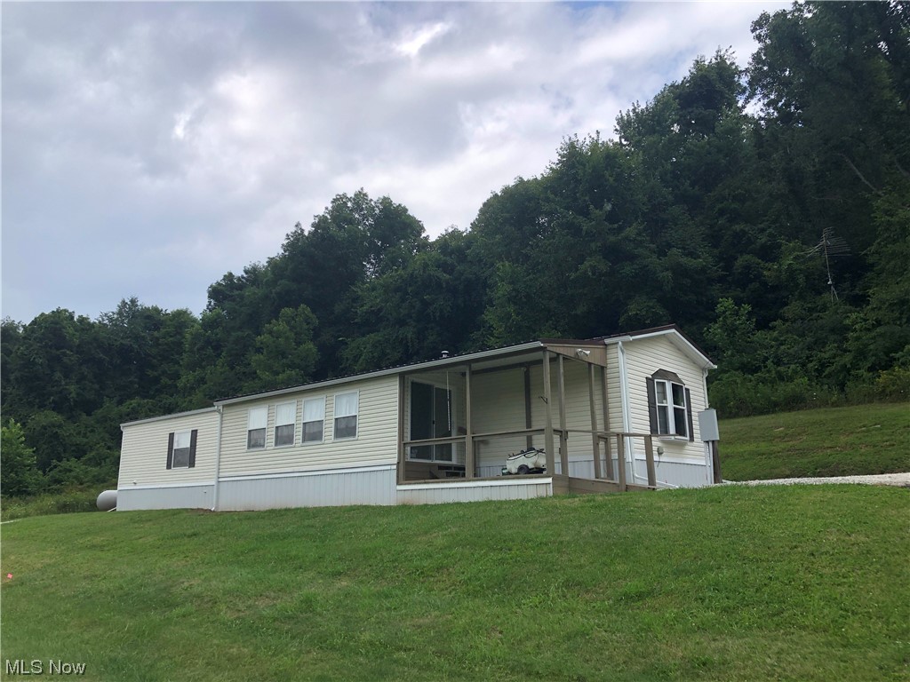 If you enjoy the country living, this is the place you want to check into! Well cared for 2013 Mobile home with 3 bedrooms and 2 baths on over 25 acres. Open concept, split bedroom floor plan. Eat in kitchen has plenty of cabinets, laminate flooring and is complete with appliances. The living room offers a fireplace and laminate flooring. Master bedroom includes a bath and large walk in closet. There are two additional bedrooms and the main full bath as well. Relax with a good book or simply enjoy the view and wildlife in the front "Florida room". Recent updates include the "Florida" room addition. There is currently a new septic being installed. Make the call to tour this home and property soon so you can make it your own and enjoy all the beautiful colors this fall.