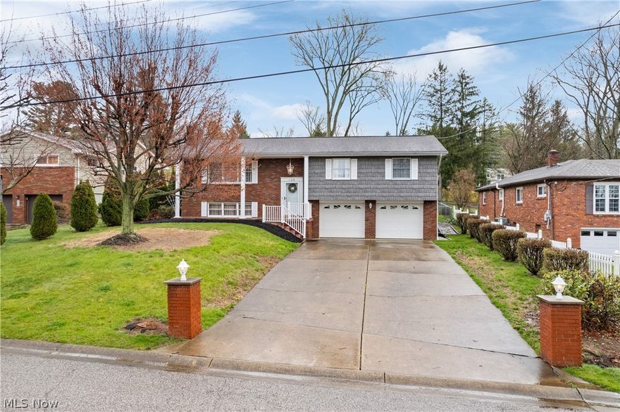 Welcome to your dream home in a desired cul-de-sac! Enter through the front door and smell the brand-new carpets and new paint throughout or come in through your 2-car attached garage! This homes charm and updated living space has so much to offer! The split level gives you an open concept with a twist. On the main level you will find a large eat in kitchen with oak cabinets, a substantially sized living room, an owner's suite, 2 more bedrooms, and another full bath! Step down to the lower level to find another finished living room/rec room, a finished laundry room, ample storage and a large 2 car garage with a work bench! Enter the fenced in backyard through your french doors in the kitchen to find a covered back deck and a large pool complete with a new gas heater and pump! Store your garden tools in the shed and tend to your strawberry garden just to the left of the shed!  Take yourself, the dogs or the kids for a nice stroll around the Woodland Terrace loop in the evening. The possibilities are endless with this one-of-a-kind home in St. Clairsville! Call for your showing today! Agent is related to sellers.