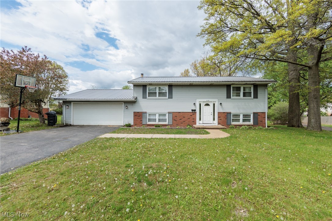 Welcome to 1140 Smith Rd. in Ashland, a spacious and updated bi-level with 4 bedrooms, 2 full bathrooms, and 2,080 square feet on a 0.34-acre lot. Located near I-71 and minutes from downtown, this home offers comfort, convenience, and a private backyard that backs up to open fields. The open main level is bright and inviting, while the refinished lower level (2024) features a second living space, mudroom area, and two additional bedrooms. The lower-level bathroom was updated in 2024 with a new vanity, sink, toilet, and plumbing. Major upgrades include new central air and furnace (2024), tuck pointing around the garage (2024), hot water tank (2025), electrical panel and outlets (2022), kitchen ceiling fans (2022), and a new front door (2022). A stone accent wall highlights the wood-burning stove on the lower level. Appliances include a refrigerator, washer, and dryer (2022), plus a newer microwave and dishwasher. Outside, relax on the two-tiered deck and enjoy the peaceful views. Two-car attached garage. Public water and sewer. Schedule your private showing today.