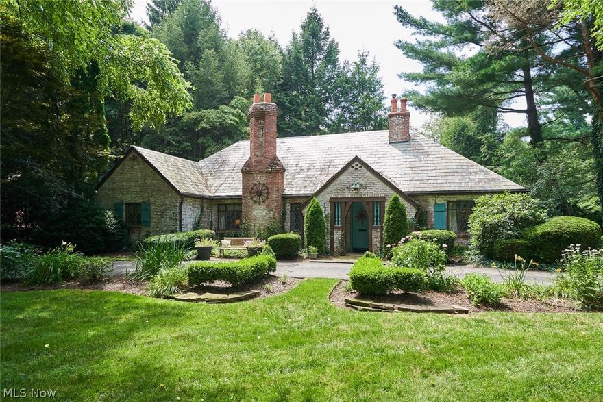 Welcome home! Sought after Kemppel home tucked into West Akron. The grounds are full of beautiful flowering perennials and immaculately landscaped beds. Entering the front door you are instantly greeted by this home's charm and character!  To the right is the hearth room, which is comfortably situated around one of six fireplaces. The kitchen has refinished cabinets, stainless steel appliances, granite countertops and ambient heated floors. The large dining room opens to an over sized living room & a bonus space, currently used as a bar, with two doors to the amazing backyard. The dining/living rooms boast refinished gorgeous hardwood floors. The formal living room has built-ins and ample space for entertaining. Three large bedrooms, a full bath, an addtl. family room w/ slate floors, wood beamed ceiling, brick fireplace and a HUGE mudroom/storage space finish off the first floor. The Master bedroom is quite spacious and features french doors that lead to a rooftop balcony overlooking