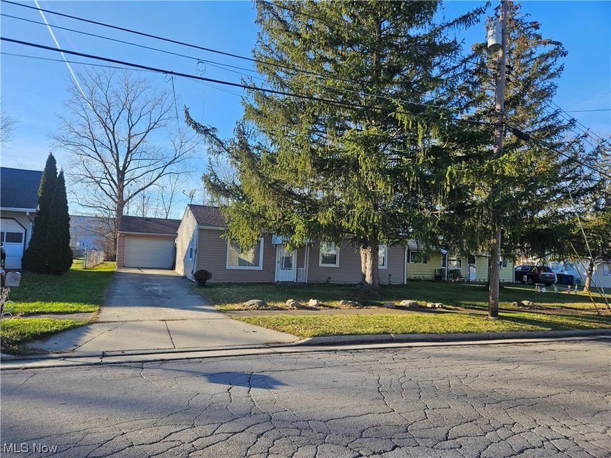 Charming 3-bedroom ranch home on a quiet low traffic side street. It is walking distance to the Lake front beach & park, the Vermilion River channel and the awesome Downtown Business Area, which features many restaurants and outdoor activities throughout the summer. This home is move in ready. The concrete driveway was put in 2016. All of these updates were made in 2021; new Vinyl siding, doors, windows, roof, Furnace & Central Air conditioner, hot water tank, electrical panel & all switches & receptacles and all lights and ceiling fans. 
This house is being sold as is, no further repairs or improvements will be made. So Note-the garage also had a new roof in 2021, but it has not been painted. The backyard had a beautiful flower garden surrounded by rocks. It would be up to a new owner to keep up or remove and plant grass.