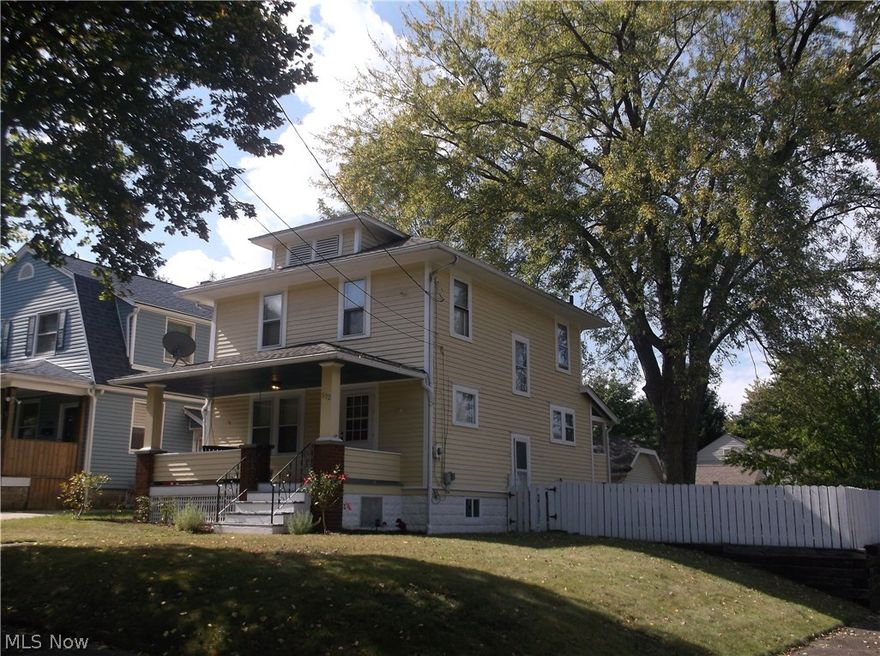 My goodness! Hey you buyers out there looking under 70,000- do yourself a favor set a private viewing and walk through 572 Lindell St. here in Akron, this three bedroom colonial located in historic Goodyear Heights has plenty to offer you! We offer you a large front porch for summer and fall sitting, a formal dining room, beautiful hardwood floors on the first level, a gorgeous fireplace with built-ins, updated and applianced kitchen including a dishwasher and perfect back splash, there's large freshly painted woodwork throughout the home an updated bathroom with a separate shower from the tub very cool! Tastefully decorated freshly painted throughout, a back deck through the kitchen, fenced in backyard and just a wonderful curb appeal on this corner lot, this home also comes with the home warranty set your private viewing today!