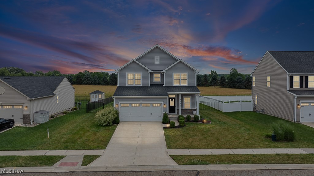 Welcome to this stunning Colonial-style home nestled in the desirable Cranberry Creek development in Brimfield Township, located within the Field Local School District. Offering 5 spacious bedrooms and 4 bathrooms, this home blends timeless charm with modern updates including all-new carpet throughout —perfect for growing families or those who love to entertain. Step inside to discover a light-filled open-concept first floor featuring a cozy living space and, of course, the heart of the home - a stylish kitchen, complete with white subway tile backsplash, granite countertops, ample cabinetry, a pantry, and a kitchen island ideal for casual meals or gatherings. A convenient powder room completes the main level. Upstairs, you'll find four generously sized bedrooms, including a luxurious master suite with a walk-in closet and a private full bath boasting dual vanities. For added convenience, the second-floor laundry closet makes household chores a breeze. The newly renovated basement is a true bonus space, featuring a large recreational room, a fifth bedroom with an egress window, and a full bathroom—perfect for guests, a teen suite, or multi-generational living. Two separate storage rooms provide additional functionality. Enjoy the outdoors in your private backyard oasis, which backs up to a scenic open field. Relax on the back deck, gather around the fire pit, and appreciate the privacy of an elegant black aluminum fence with three separate gates for easy access and security. Don't miss your chance to own this move-in-ready home in a prime location. Schedule your private tour today and experience all that this beautiful Cranberry Creek home has to offer!