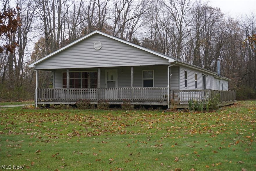 Lovely Country setting on almost an acre of land! The property sits well off the road and has easy access to State Rte. 30. This  3 bedroom, 1.5 bath ranch has so much potential. Very spacious living room with bayed window, kitchen complete with breakfast bar, electric range and refrigerator. Dinette area includes French Doors which access the side deck.  Nice size utility room includes the homes mechanicals and washer and dryer. You are sure to appreciate the large garage....1 stall garage for parking your car in and the other side for storage or work shop area.  Note: The driveway is across the street of the big red bank barn! Assessment is Muskingum Water Shed ($3.00 a half).