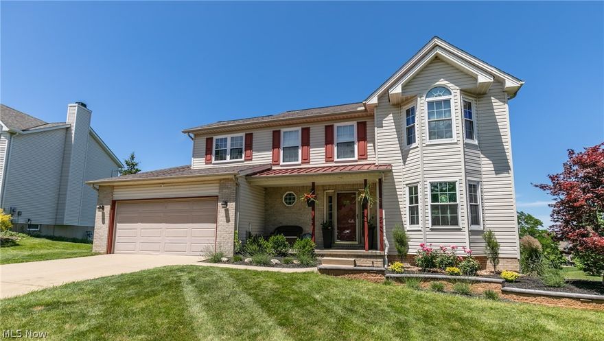 This must see colonial is great for family and entertaining. You and you guests will be invited by an open porch and beautifully lighted landscape. Through the foyer, the eat in kitchen opens to a large family room, with vaulted ceilings, that boasts a fireplace framed on a wood accented wall. Additional outside entertainment space off of the kitchen is afforded by a large elevated deck that offers outstanding views, especially at night. The first floor is completed with the dining and living rooms, a half bath, and a laundry room that is conveniently located off of the attached garage. The roomy master will be found on the second floor and features a master bath with double vanity, separate shower, and a jetted bathtub. Three additional bedrooms and a full bath fill out the second floor. The lower level is a complete suite with its own laundry area that would be perfect for accommodating overnight guests or providing private living space for parents or older children. With 1200+ sq ft