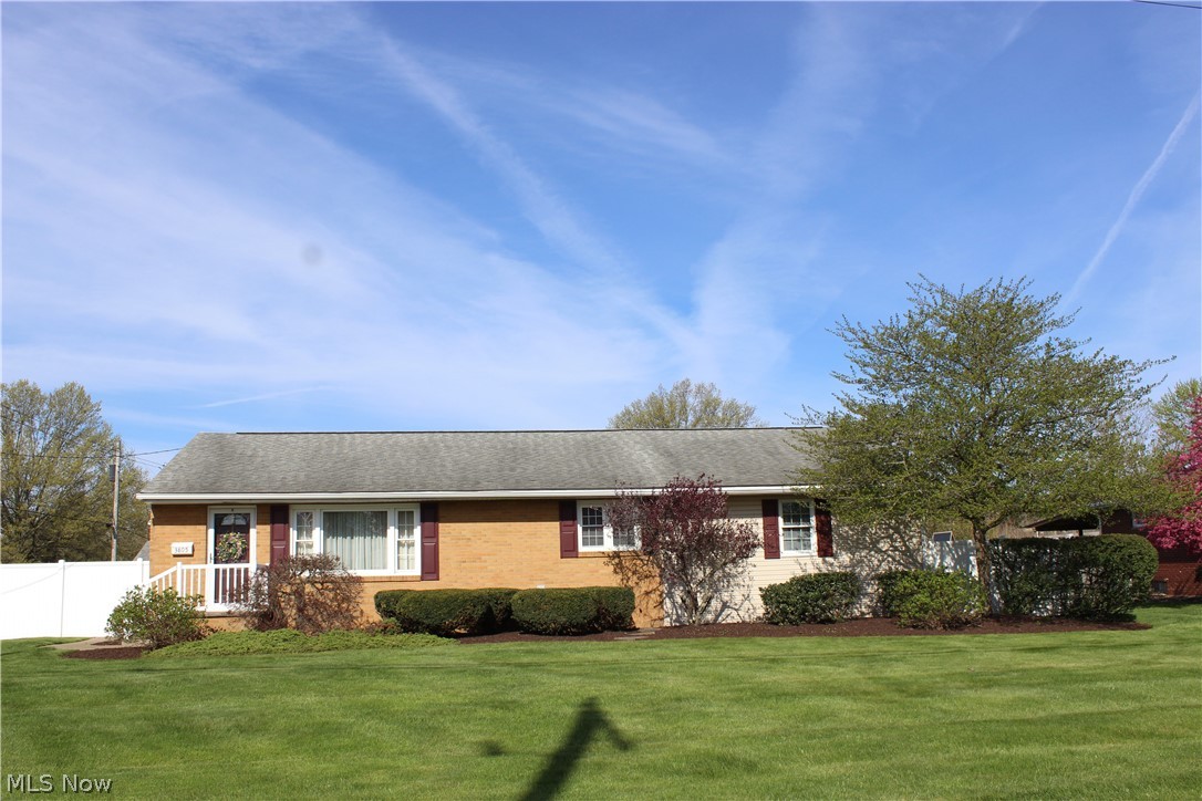 This well maintained Brick ranch home is bursting with curb appeal and oozing with charm! The moment you pull into the driveway, you'll admire how well groomed the yard and landscaping is. Walk inside the gate into a smaller fully fenced area, and be surprised by the delightful garden area, dotted with perennial plants, outdoor lighting and patio. Once inside, the pride of ownership is clear as you walk into each room. The home has a very neutral decor, which will match everyone's style. Very nice, bright eat-in Kitchen area has nice appliances and newer flooring, and the front Living Room is light and airy. In 2005 the sellers added onto the home, which allowed for a large Main Bathroom expansion with a large vanity and oversized shower/tub combo. All 3 Bedrooms have newer carpeting. The 2nd and 3rd BR's are generously sized, with huge closet space and an additional hall closet for plenty of storage. Downstairs, the lower level Recreation Room adds nice extra finished room to enjoy, and the Laundry area no doubt is one of the nicest you'll see! Washer and Dryer will stay, along with a very nice utility tub and 2nd newer SS fridge. Additional unfinished separate basement storage room, too. Owners have done so many updates - newer CAC, Bathroom remodel, replacement windows, gutter helmet, glass block, concrete driveway and sidewalk, flooring, painting, updated electric, new water heater, replacement lighting throughout the home, and so much more. The nice yard has additional unfenced backyard area and side area. The former garage would make a great "She Shed" or "Man Cave", the large concrete drive is double wide, with an additional parking area perfect for a boat, camper, or extra car. Be sure you check out this great home and all it has to offer. Owners have lovingly cared for this beauty over the years, and it's a great opportunity at a very affordable price.