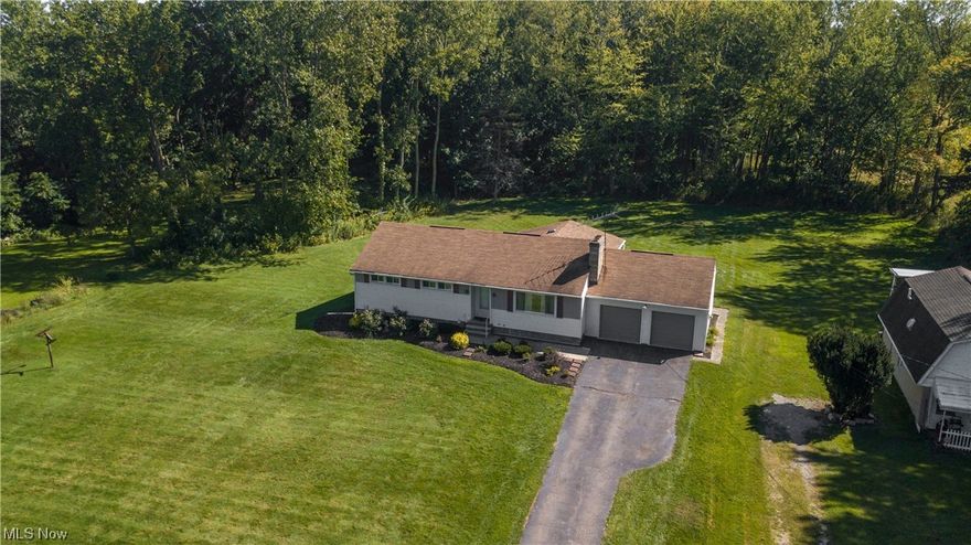 3 bedroom 2 bath Ranch style home on over an acre of land that backs up to the Metro parks! Beautiful hardwood floors, two full wood burning fireplaces and a propane gas heater in the addition. The home features a Full basement with bar, waterproofed in 2005. Spacious bedrooms, with owners suite. Large back deck with a retractable awning that overlooks the Metro parks. Clearview LSD!  Beautiful private setting and a rare find! Set up showing today.
