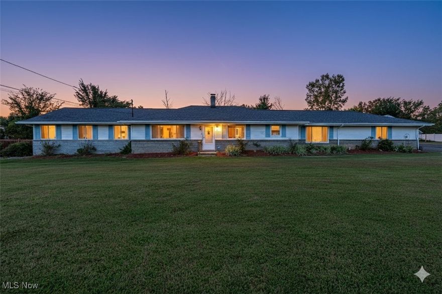 Welcome to 19740 Benbow Rd in Strongsville – a private ranch retreat nestled on 1.51 acres! This expansive property offers the perfect blend of comfort, space, and convenience. With 4 spacious bedrooms and 2.5 baths, this home is designed for both everyday living and entertaining. The heart of the home is the recently updated eat-in kitchen, featuring rich cherry wood soft-close cabinets, granite countertops, and stainless steel appliances that stay. Just off the kitchen is a cozy living space perfect for casual gatherings, while the second living area offers warmth and charm with its wood or gas-burning fireplace—ideal for relaxing evenings. The primary suite addition is a true sanctuary, complete with a massive walk-in closet, a luxurious en suite with jetted tub and separate shower, and a dedicated work-from-home nook. A second full bathroom is conveniently located between the other bedrooms, and a half bath is tucked near the fireplace lounge for guests. Downstairs, the finished, waterproofed basement expands your possibilities—ideal for a theatre room, game room, or man cave—plus a flex room perfect for an office. Additional storage options include unfinished basement space and two crawl spaces. Enjoy peaceful mornings or host summer get-togethers on the wrap-around deck, accessible from the primary suite or back hallway. A two-car attached garage and a versatile two-story outbuilding with electric and heat provide ample space for hobbies, storage, or additional vehicles. Located minutes from freeways, shopping, restaurants, and Strongsville’s top-rated community amenities, this home offers privacy without sacrificing convenience. Don’t miss your chance to own a rare gem in Strongsville with room to roam and space to grow!