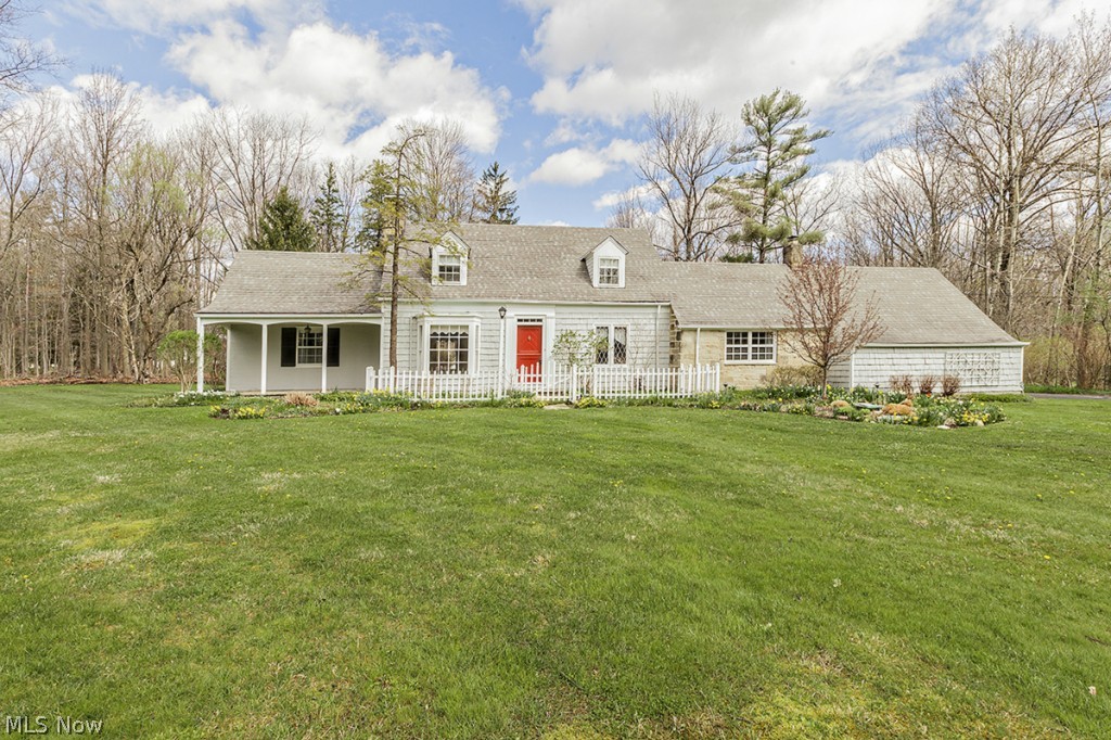 Welcome home to this warm and inviting Cape Cod with picturesque views. The 1st floor boasts a charming sun lit living room with stone fireplace and bay window and opens to the dining room with bay window, charming kitchen with separate eating area, paneled family room with 2nd fireplace and built-ins and access to the screened porch. Fabulous vaulted master suite with large bath and 2nd bedroom with hall bath also on 1st. Two additional bedrooms, hall bath and large cedar closet on 2nd. Beautiful hardwood floors. Gorgeous backyard. Country feel yet close to everything. Just move in!