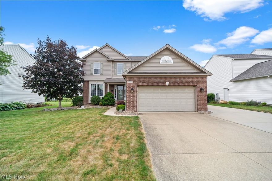 Welcome to 9704 Kingston Trail, a beautiful colonial in Olmsted Township! This home features 4 bedrooms, 2 full bathrooms, 1 half bathroom, and over 2500 square feet of living space. The front door opens into a beautiful foyer with hardwood flooring that flows throughout. To the left of the foyer is the living room with carpeting that flows seamlessly into the spacious dining room. From there, you enter into the expansive kitchen where you will find plenty of cabinetry, stainless steel appliances, and a breakfast room filled with natural light that accesses the back patio. On the other side of the kitchen lies the family room, you'll find a beautiful fireplace, large windows offering a ton of natural light finished with plush carpeting. A half bathroom and laundry room complete the first floor. Upstairs, lies 4 bedrooms which all include carpeting and plenty of closet space. The primary suite boasts an ensuite full bathroom with double sinks, plenty of storage, a walk-in shower, and closet. A second bathroom completes the upper level. The lower level offers plenty of extra storage space. Outside is a fully fenced in backyard with pond views, a patio, and an attached 2-car garage. Woodgate Farms features a beautifully maintained pool and resident clubhouse. Olmsted Township is a charming, well established community, exempt from RITA taxes with award winning schools. You do not want to miss this one!