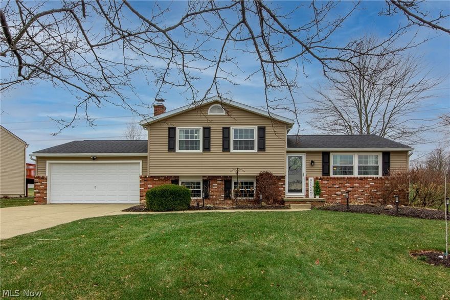 You have to see this home! This property in Green sits on a spacious .4 acres nestled in the entrance to a quiet cul-de-sac. The lot has a large stamped concrete patio ('20) with a private natural bamboo screen for privacy with electric and patio lighting, wonderful landscaping with tall grasses and beautiful trees, a basketball hoop, and a huge 10x20 barn ('20)! Completely remodeled throughout, there's almost nothing in this home more than 10 years old.  The kitchen remodel features solid hardwood cabinetry with a spacious pantry cupboard, newer stainless appliances, very nice granite counters, and opens to a formal dining room with sliding glass doors ('20). Beautiful bamboo flooring on the main level ('16) and some upstairs ('14), many newer vinyl Low-E windows ('16) with transferable 1 yr warranty, updated furnace ('21) with air scrubber and AC ('13), newer hot water tank, new outdoor lighting, and all newer fixtures or recessed lighting throughout. Family room remodeled with half