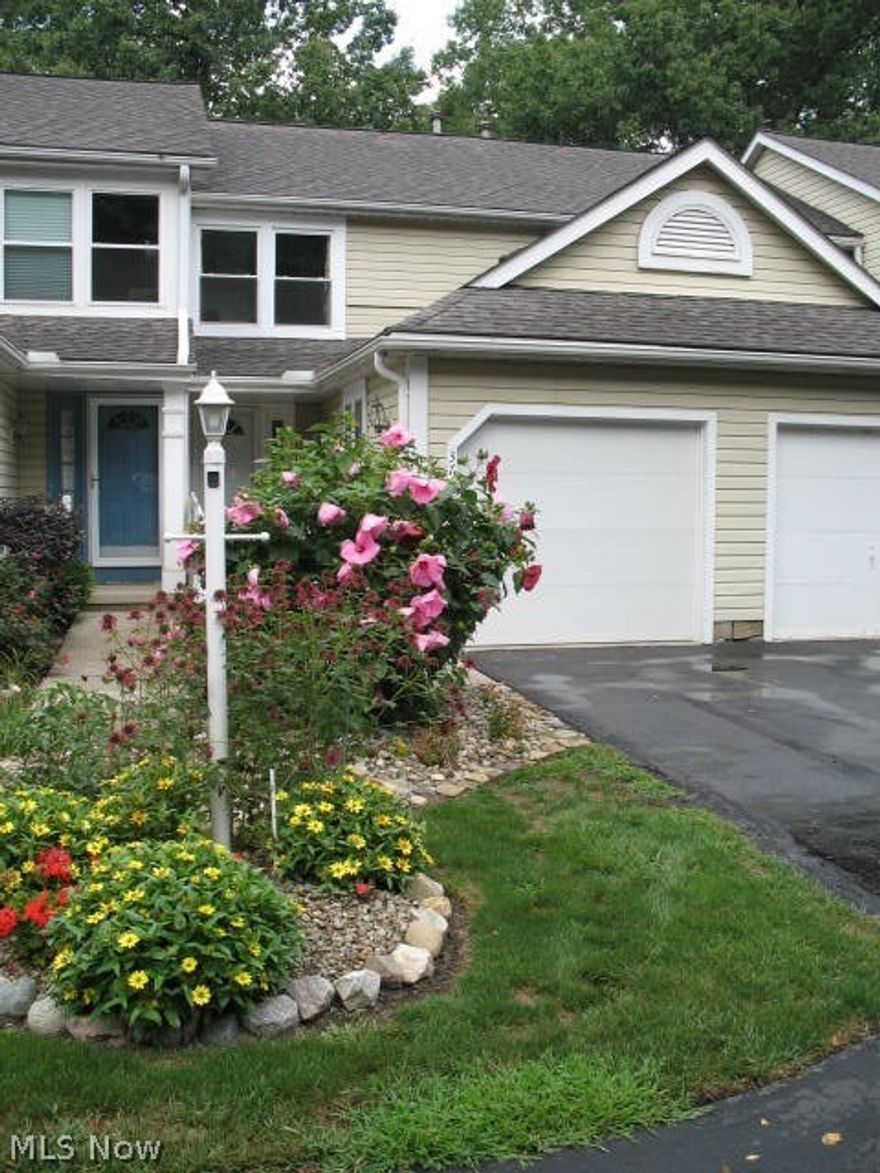 Stunning 2 bedroom, 3 bath townhouse with new Pergo and vinyl flooring and paint throughout.  Main floor has beautiful floor-ceiling gas fireplace & logs, new Pella sliders, blinds opening to new Trex deck and railings.  Kitchen equipped with breakfast bar, new sink, hood, dishwasher and refrigerator.  Upstairs has 2 large bedrooms plus full bath, new Pella windows and double closets.  Lower level has additional 450 finished square feet.  New 1/2 bath.  Family room with new Pella sliders/blinds open to landscaped stone patio with wood fence.  See attachments with documents.