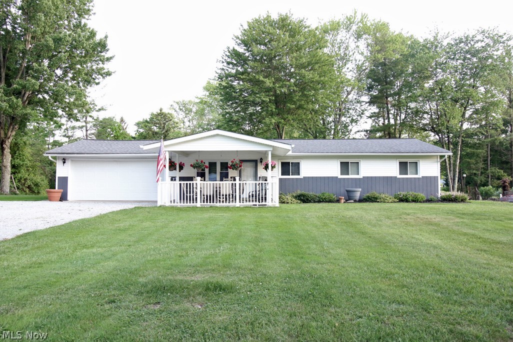 Updated Ranch on over ½ acre of lawn. Lots of space to create an outdoor oasis for your summer enjoyment. The driveway has extra parking space & the awesome 16x16 covered front porch complete with white vinyl railing and ceiling fan! What a great place to relax outdoors. The oversized living room with electric fireplace that allows you to arrange your furniture several ways. The living room opens to the kitchen dinette area located off the kitchen. The kitchen updated in 5/21 with white tile backsplash, faucet, countertops and stainless-steel sink. The refrigerator and range will remain with the home. Off the kitchen is the laundry/utility room. The washer and dryer will remain. At the rear of the home is a 20x10 multipurpose room that can be used for so many ways. The carpet in this room was replaced in 2021. The half bath has newer vinyl laminate flooring. The main bath has been updated and offers a gorgeous white vanity with white/gray granite countertop, comfort height toilet and b