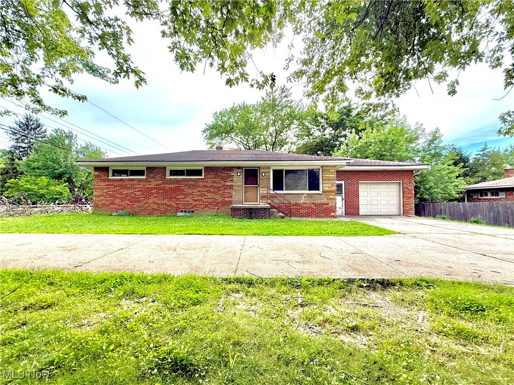 Welcome to 3241 State Route 43, Mogadore — a charming all-brick ranch with a one-car attached garage featuring 1,161 sqft with 3 bedrooms and 1 full bathroom, set on a .43-acre lot in Brimfield Township. Inside, you’ll find a spacious living area with a dinette that opens to a covered back patio, three well-sized bedrooms, and a bathroom with a double-sink vanity. Original hardwood floors run through the hallway and bedrooms, ready to be refinished to your taste. Additional highlights include A/C & Furnace (2020), Well Pump (2020), Water Softener, Vinyl Windows throughout and the full-sized basement is waterproofed offering ample storage and great potential for finishing. The property includes a convenient side-street entry driveway off of Sunview Drive with connects to the other driveway off of State Route 43, providing easier access + extra parking + a turn-a-round. Immediate occupancy upon closing! Don’t miss your opportunity—schedule your showing today!