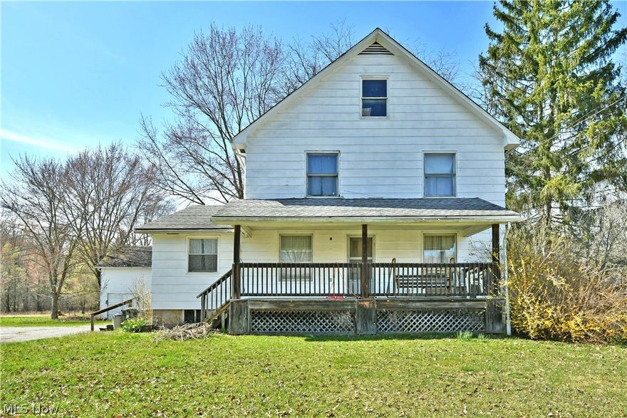 Unlock the full potential of this substantial Champion home, offering a renovation-ready three-bedroom layout and an impressive outbuilding! Set in a scenic, tree-lined lot, this residence has all the right pieces to create something special. A large, covered awning sits just off the driveway, a perfect place to relax out of the sun on warm summer days ahead. Through the front door, a carpeted living room showcase a rustic, wood burning stove as a secondary gas heater presides next to a spacious den or guest bedroom. A nearby great room stretches out towards the kitchen as it provides easy dining space. The kitchen itself delights with its wraparound layout to feature optional bar top seating and easy serving. A central pantry/laundry transitions past a half bath before opening into the library. Upstairs, a trio of additional bedrooms surprise with ample living space. Built in cabinet storage waits the hall while a glass block trimmed full bath completes the floor. A hidden staircase leads up to the third-floor attic for storage or finished as needed. Utilities are located at the basement level. Selling "as is" to settle an estate.