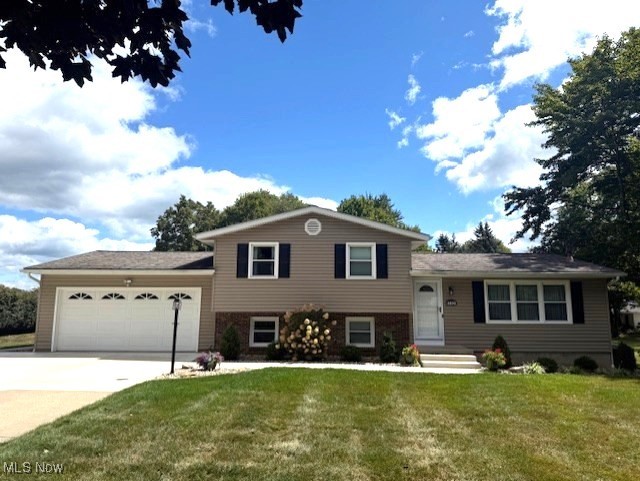 Absolutely stunning four-level split offering nearly two acres of park-like grounds—meticulously cared for by its original owner. This spacious residence features three (potentially four) bedrooms and two beautifully updated full baths, blending classic charm with modern upgrades. The inviting family room, anchored by a cozy wood-burning fireplace, flows effortlessly to the two-car attached garage—ideal for ease of access and practicality. The large, fully equipped eat-in kitchen is a true heart of the home, with sliding glass doors that open to a generous deck overlooking the lush, landscaped yard—perfect for both quiet mornings and lively summer gatherings. Recent updates throughout—new carpet and flooring installed within the last two years—add freshness underfoot. The home’s investment in essential systems is impressive: a new dishwasher (2025); central air (2023); reverse osmosis system (2024); water softener (2022); furnace (2019); hot water tank (2021); plus updated windows, exterior doors, and siding (2010–2012); and a roof installed in 2014. Even the garage sports a brand new concrete floor, and fresh concrete sidewalks and a partial driveway were poured in 2025, along with an updated panel box. Outside, you’ll discover a spacious 34' × 24' pole building with a 10-foot tall garage door and a 7-foot side door—ideal for storing a boat, camper, or multiple vehicles. This home is truly move-in ready—don’t miss your chance to experience its thoughtful layout, thoughtful upgrades, and serene outdoor setting. A rare opportunity for both comfort and convenience on a beautiful property.