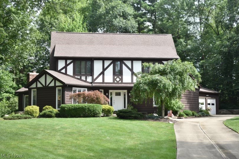 Rare opportunity to own this one of a kind Tudor home on a quiet cul-de-sac street off of Lake Forest in Hudson. Updates throughout this beautiful home. Numerous built-ins, walk-in pantry and plenty of storage make this functional floorpan even better. Tons of over sized Anderson windows offer plenty of natural light. A large foyer welcomes you in. The kitchen has gorgeous quartzite counters and new appliances, ready to use as you look out the huge picture window with bench seat to the back yard. The upstairs hall bath has tile and quartz with a double vanity and a nice soaking tub. 2 of the bedrooms have built-ins and window seats. The large primary bedroom has a walk in closet with tons of built in shelves. The primary bath has a double vanity with granite counters and a walk in tile shower with corner bench. The full unfinished basement is water proofed and rough in plumbed. The home has a Radon system. New Roof and Gutters in 2020. WELCOME HOME!