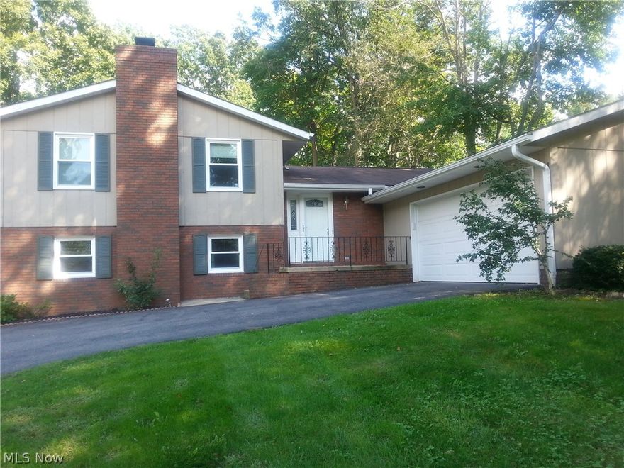 Beautiful split level home in Jackson Twp! Nice private setting surrounded by foliage. Open design and plenty of natural light on the main floor with an added sunroom attaching to the back deck. Master bedroom with full bath/shower and a deck that overlooks the back yard. Two more bedrooms and a full bath upstairs. The first lower level has a beautiful fireplace, plenty of windows, a good sized bedroom and a huge half bath. Basement is also finished with a kitchenette perfect for holiday cooking and guests! This is the house for the holidays! Two full kitchens and loads of space!!!