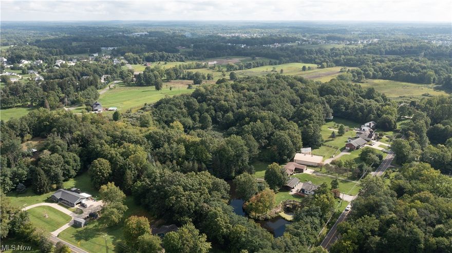 This vacant lot is located on Lynn Rd. In Brimfield Twp. and features approx. 11.498 acres (mostly wooded) and two outbuildings consisting of a 30’ x 40’ pole building with 4 stalls, and a 54’ x 75’ Morton pole building with large sliding doors in the front, concrete floors, and electric. There is also a fenced paddock, and a paved drive to the barns, in addition to an ingress and egress easement on Edson Rd. This property would make a great home site, small hobby farm, recreation property, or possibly a HQ for someone in landscaping, construction, etc. Call Today!
