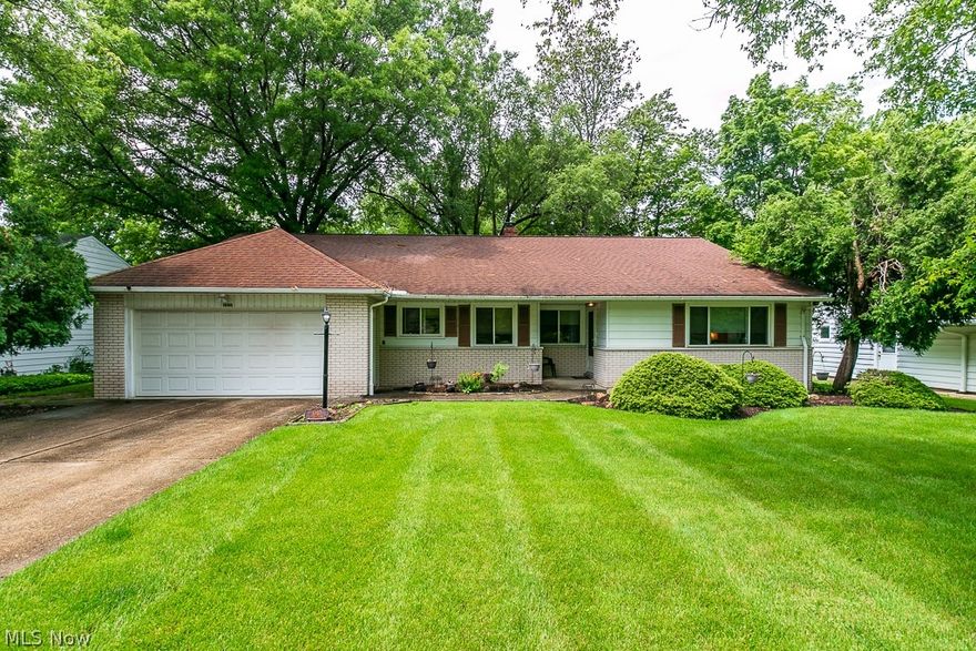 Charming home nestled on beautiful lot!  Large eat in kitchen features plenty of cabinets and all appliances stay!  Gorgeous hard wood floors throughout!  Master suite with full bath has newer travertine flooring!  All bedrooms generous in size and closet space! Rec Room in lower level is ideal place to relax and entertain!  It features fireplace and sliding glass doors to covered patio.  Huge back yard is fenced in and is perfect for kids/pets.  Impeccably maintained, this is the one!