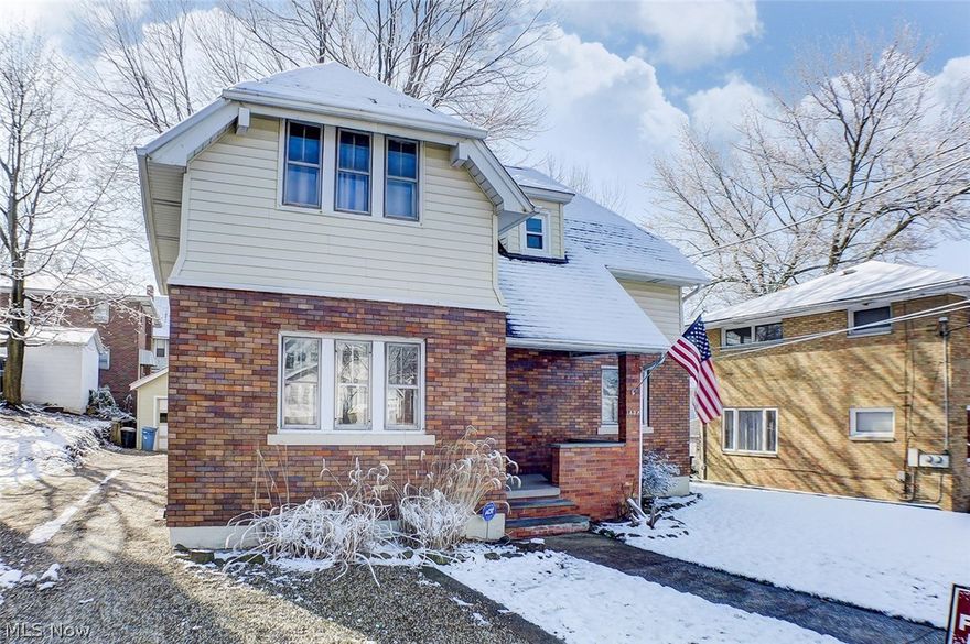 Classic Goodyear Heights Colonial with natural woodwork with classic features.  This home has been well cared for.  The first floor has been updated with a more open floor plan.  The  updated kitchen has oak cabinetry and ceramic floors: the appliances are included.  The garage has extra attic storage space.  Many Updates:  Roof 2008, electric 1997, Attic insulation, hot water tank 2016, furnace and central air 2006, Newer entry doors and all new drains in basement floor.  Updated bathroom with ceramic tile.  This home is clean and well maintained. Schedule your private tour today!