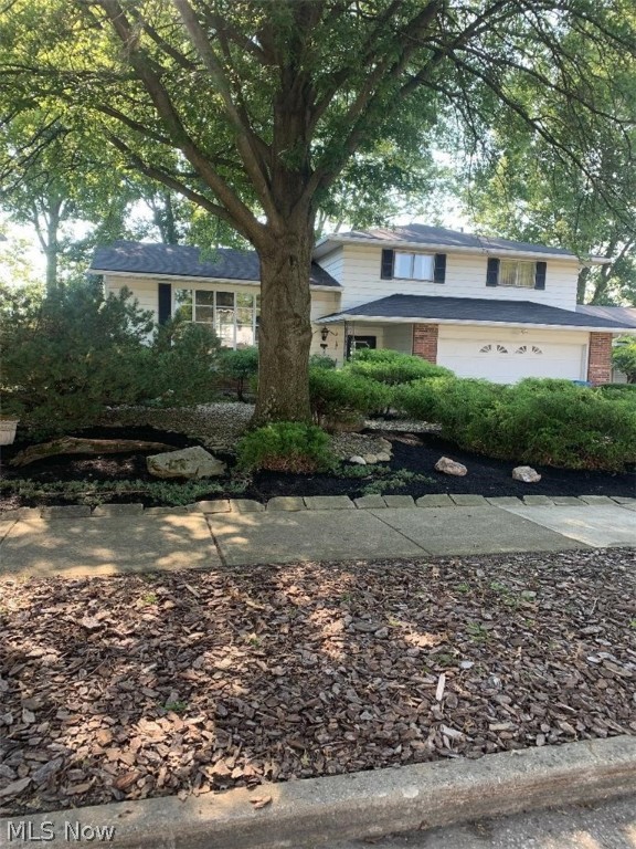 Spacious 4-level split on a quiet tree lined street. Nice hardwood floors through out. Living room has a large picture window to let in lots of natural light. Neutral paint colors. Kitchen has been updated and all appliances stay. Upstairs there are 4 bedrooms and a full bath. The master bedroom has its own half bath. The lower level has an updated half bath and family room with cozy gas fireplace. There is a sliding patio door that leads to an oversized patio that is perfect for entertaining and a low maintenance yard. There is also a basement rec room for additional square footage. Washer and dryer stay. Generous sized 2 car garage. This home has been lovingly maintained and filled with wonderful memories by the same owner for years! Schedule your showing today!