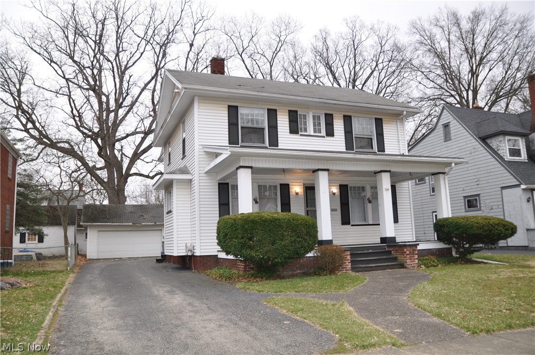 Spacious 3 bedroom home with beautiful natural woodwork, French doors, built-ins, gas fireplace, hardwood floors, kitchen w/breakfast nook, formal dining room, sunroom/office on 2nd floor, walk-up attic, toilet & shower in basement, vinyl siding, large covered front porch & 2 car garage.
