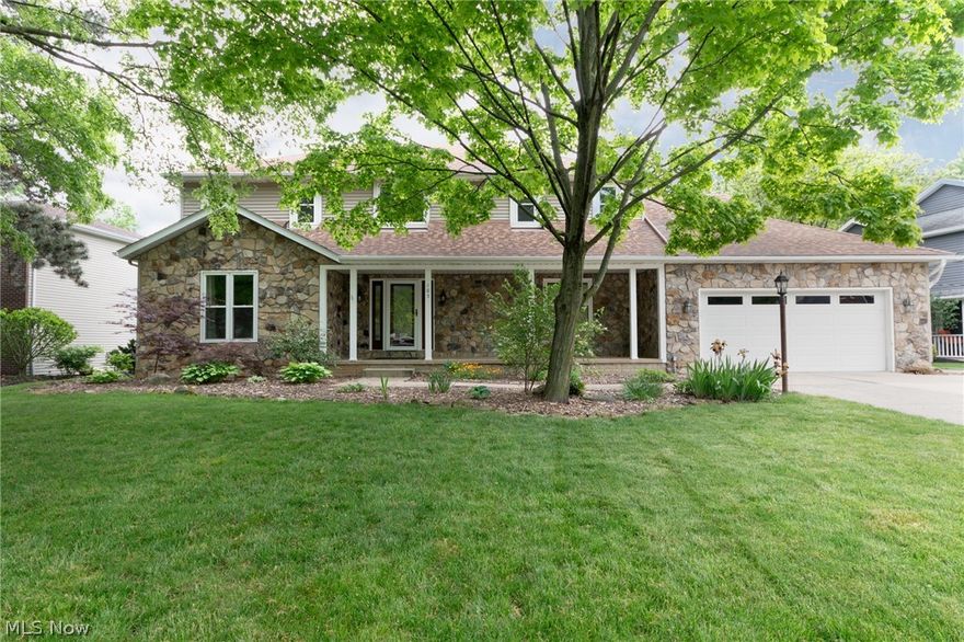 Welcome to your dream home in the prestigious Westchester Estates! This stunning 4-bedroom colonial exudes elegance and charm from the moment you arrive. The welcoming covered front porch, adorned with elegant white pillars and a striking stone facade, sets the tone for what lies beyond. Step inside to a gorgeous, open two-story foyer with vaulted ceilings that create an immediate wow factor. The formal living room, accessed through beautiful glass French doors, provides a sophisticated space for entertaining. For more intimate gatherings, sliding modern barn doors can separate the formal dining room and living room as desired. The remodeled kitchen is a dream with ornate ivory soft-close cabinetry, pull out drawers, granite countertops, tiled backsplash, undermount lighting, two Bosch dishwashers, a large island, modern light fixtures, and stainless steel appliances. The adjacent dining area boasts additional cabinetry and overlooks the family room with a stunning floor-to-ceiling stone fireplace, vaulted ceilings, skylights, large windows, and backyard access through the sliding glass door. Convenience abounds with a main floor full bathroom and a versatile first-floor laundry/office. Upstairs, the luxurious primary suite features luxury plank flooring, a walk-in closet, and a spa-like bathroom with vaulted ceilings, a skylight, dual vanities, a walk-in shower, and a luxurious tub. Three spacious bedrooms and a remodeled bathroom complete the second floor. The basement offers additional space and a workshop area, full of possibilities to fit your needs. The backyard is the perfect place to entertain friends and family and also a serene place to relax and unwind. The yard is completely fenced in with attractive black iron fencing and boasts a large deck and storage shed for your outdoor equipment. Don't miss your chance to own this beautiful home. Schedule your tour today and make this dream home yours!