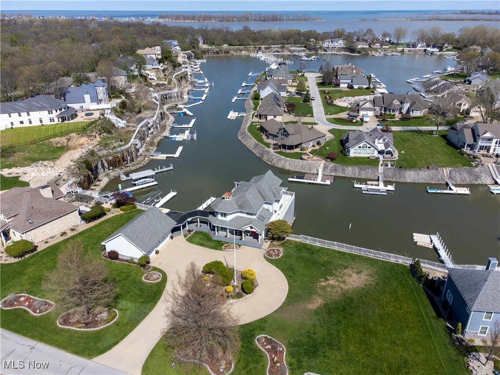 Rare Opportunity With Spectacular Space On Historic Johnson's Island!
3 Expansive Waterfront Lots, Plentiful Dockage, One-Of-A-Kind Boathouse, 1.12 Acres (3 Separate Parcels) 3rd Parcel Is Vacant! Build Your Dream! Deep Water Access To Lake Erie! Indoor Boat Storage! Captivating Waterfront Views Throughout Entire Property! Entertainer's Paradise!
1st floor feats 3 spacious bedrooms w/ walkouts, 2 full, 1 half bath, laundry room, family room; 2nd floor features huge owner suite w/walk in closet & en suite, private office, open concept kitchen & living rm, vaulted ceilings, 2-way fireplace, 3-car detached garage (29x37), 5-car capacity w/ loft space & 220amp service. Indoor boathouse (40x60) w/ 4 lifts and 220amp service. 180ft of guest dockage w/ space to add 2nd dock (120ft) & additional staircase. Irrigation.