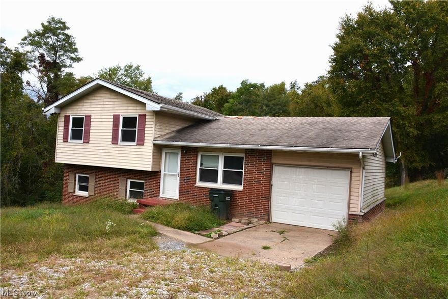 Tucked away for privacy, this home is a tri-level, 3 bedroom home with a wood burner in the basement for alternative heat.
1-car attached garage and basement for additional storage or living area. Large private back yard with outbuilding. Priced right.
Hurry-this one will not last.