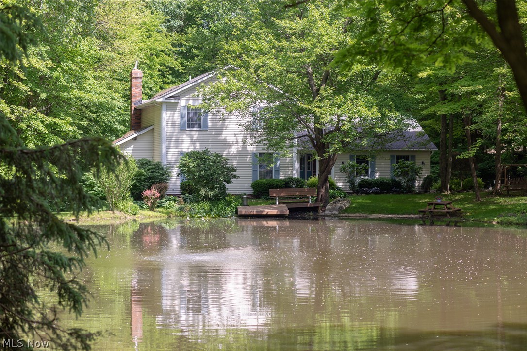 Welcome home to your one of a kind home situated on over 3.5 acres in Hinckley OH. Secluded wooded setting with your own pond, beach and dock, located on a dead end cul de sac, minutes away to Hinckley State Park. This well appointed home is an entertainer’s dream – there is a formal living and dining room with new carpet (4/19) and an expansive family with a wood burning fireplace (w/insert) with beautiful built-ins and glass doors which access a deck freshly stained this Spring with views of the wooded back yard and beyond. The eat-in kitchen boasts beautiful custom wood cabinets, granite counter tops, tile floor & back splash, stainless steel appliances and a center island for all your prepping and cooking needs. A wine / wet bar is in the perfect spot too. A laundry room with loads of storage, a full bath and a vaulted bonus room with patio doors which could serve as an office, sun room, play room or an enclosed hot tub spa oasis round off the first floor. The 2nd floor boasts the