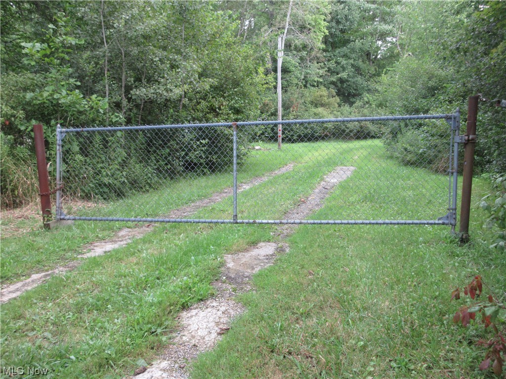 This property is mainly wooded. 300 feet of road frontage. A buildable lot in Cherry Valley Township. 1,200 feet deep. Private and Serene. Cleared paths throughout. Access with a privacy fence. Ideal getaway with barn and manufactured unit that could be updated for cabin use. 2 deer stand on property.
